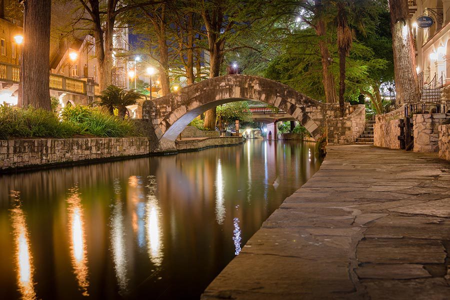 San Antonio, TX Insurance - Stone Bridge and Walking Area in San Antonio, Texas at Night